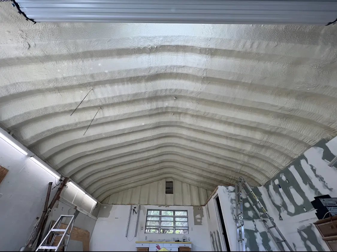 Spray polyurethane foam applied to the underside of a metal roof deck in Safford